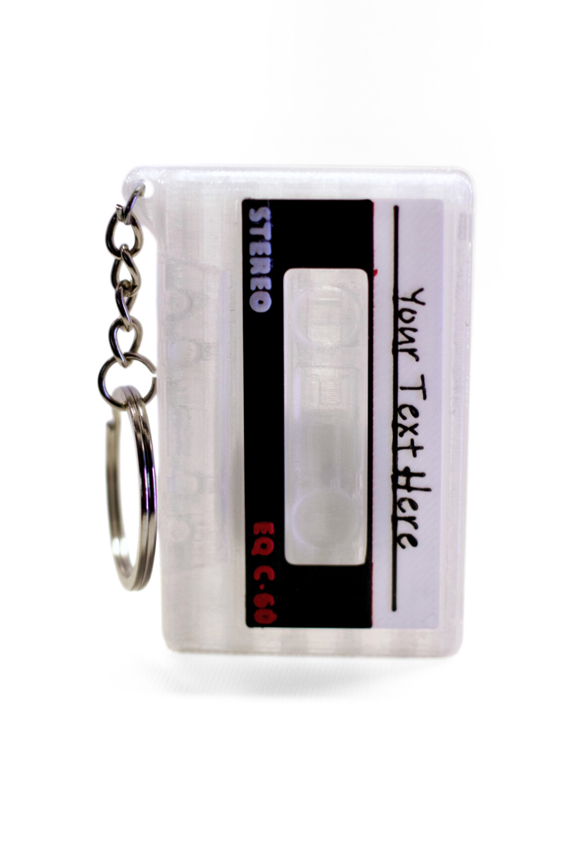 Tape cassette keychain with customizable text on a white background